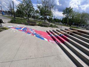 Teinture de Guy Lafleur en 3D devant un bâtiment - Ravalement Rive Sud et Teinture Héritages